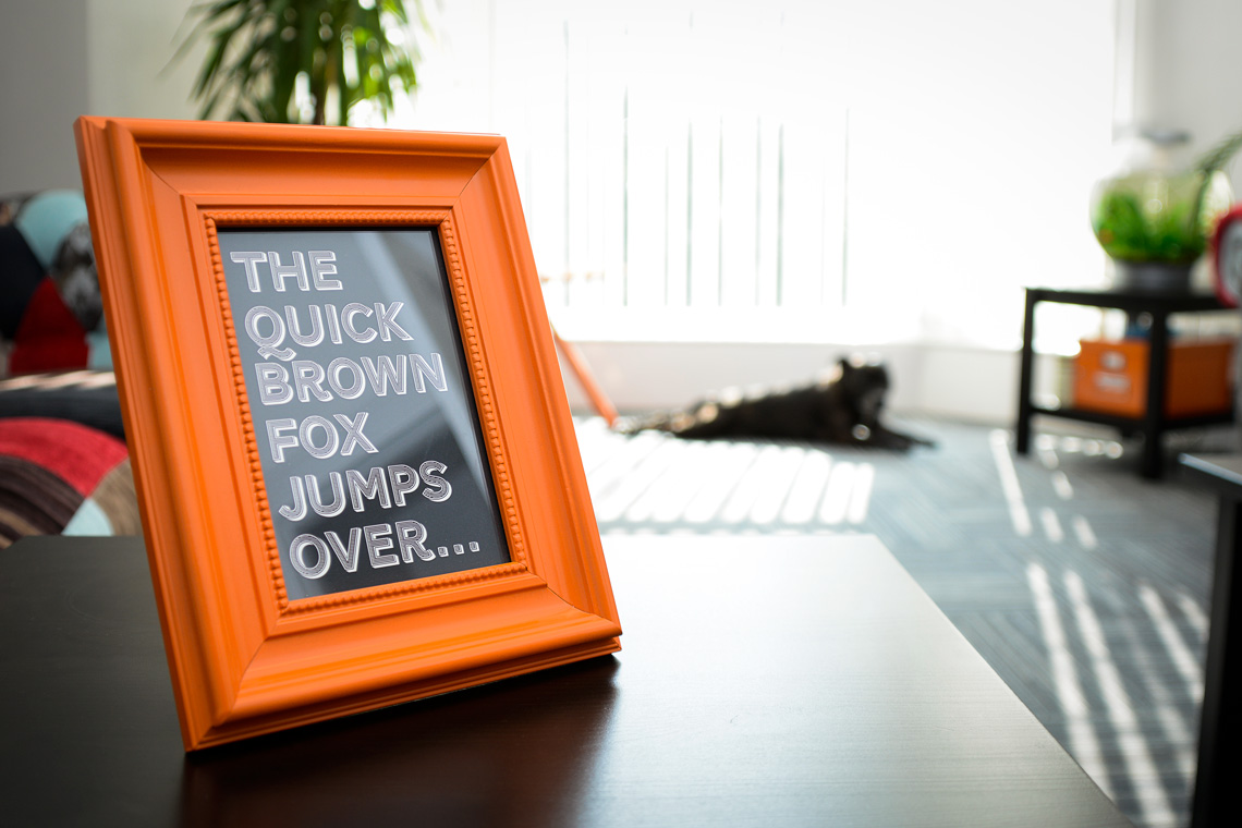A picture on a desk that reads: the quick brown fox jumped over ...